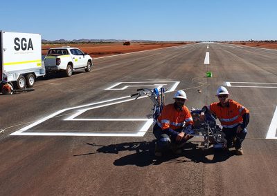 SGA team finishing off line markings on a runway